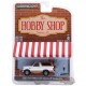 1996 Ford Bronco Eddie Bauer et Backpacker - The Hobby Shop Series 10 -1/64 Greenlight - 97100 F  - Passion Diecast 