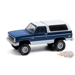 1987 GMC Jimmy Sierra Classic Lifted en Bleu Foncé et Blanc - All-Terrain  Series 11 - 1/64 Greenlight - 35190 C -PassionDiecast