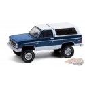 (Web Only ) 1987 GMC Jimmy Sierra Classic Lifted en Bleu Foncé et Blanc - All-Terrain  Series 11 - 1/64 Greenlight - 35190 C