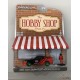 GreenMachine 1999 Nissan Skyline (R34) with Race Car Driver - The Hobby Shop Series 13 - 1/64 Greenlight - 97130 EGR