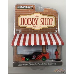 GreenMachine 1999 Nissan Skyline (R34) with Race Car Driver - The Hobby Shop Series 13 - 1/64 Greenlight - 97130 EGR
