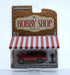 GreenMachine 2022 Chevrolet Tahoe LT Texas with Man in Suit - The Hobby Shop Series 14 - 1/64 Greenlight - 97140 FGR