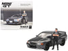 Nissan Skyline GT-R (R32) Nismo Gunmetal avec figurine Matsuda - Mini GT - 1:64 - MGT00869 Passion Diecast