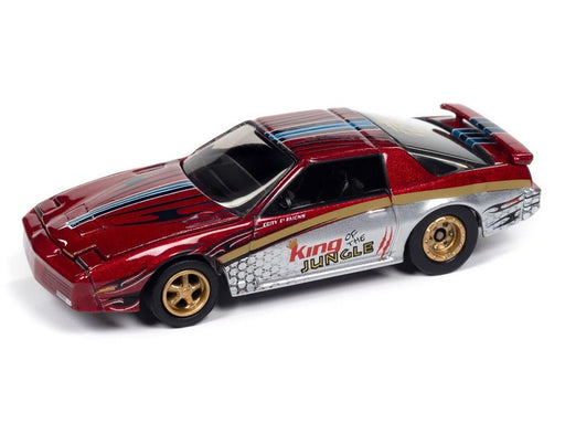 Pontiac Firebird GTA King of the Jungle 1987, couleur rouge métallique - Johnny Lightning 1/64 - JLMC034 A E Passion Diecast